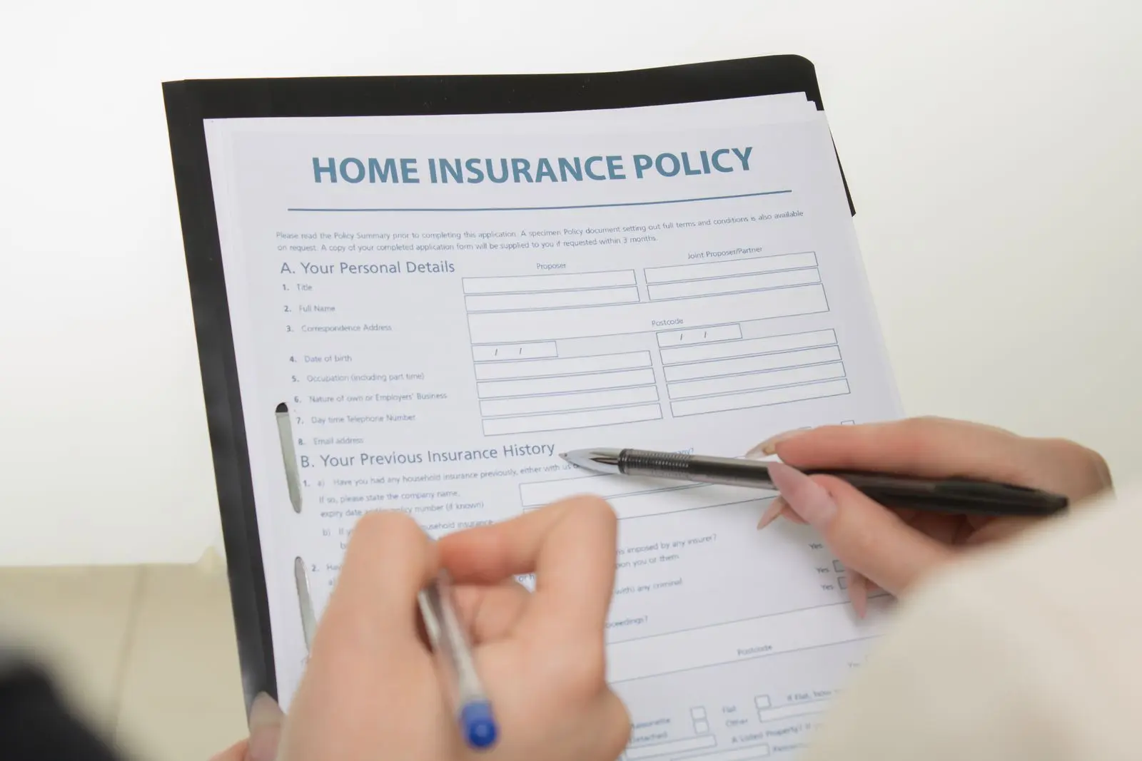 A homeowners insurance policy being completed