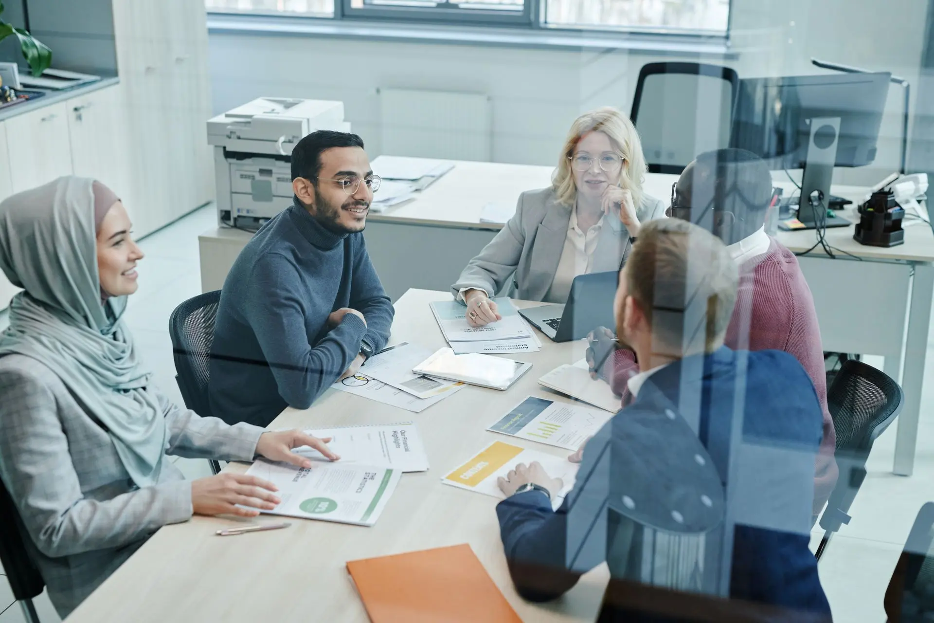 A team going through an application together in a boardroom