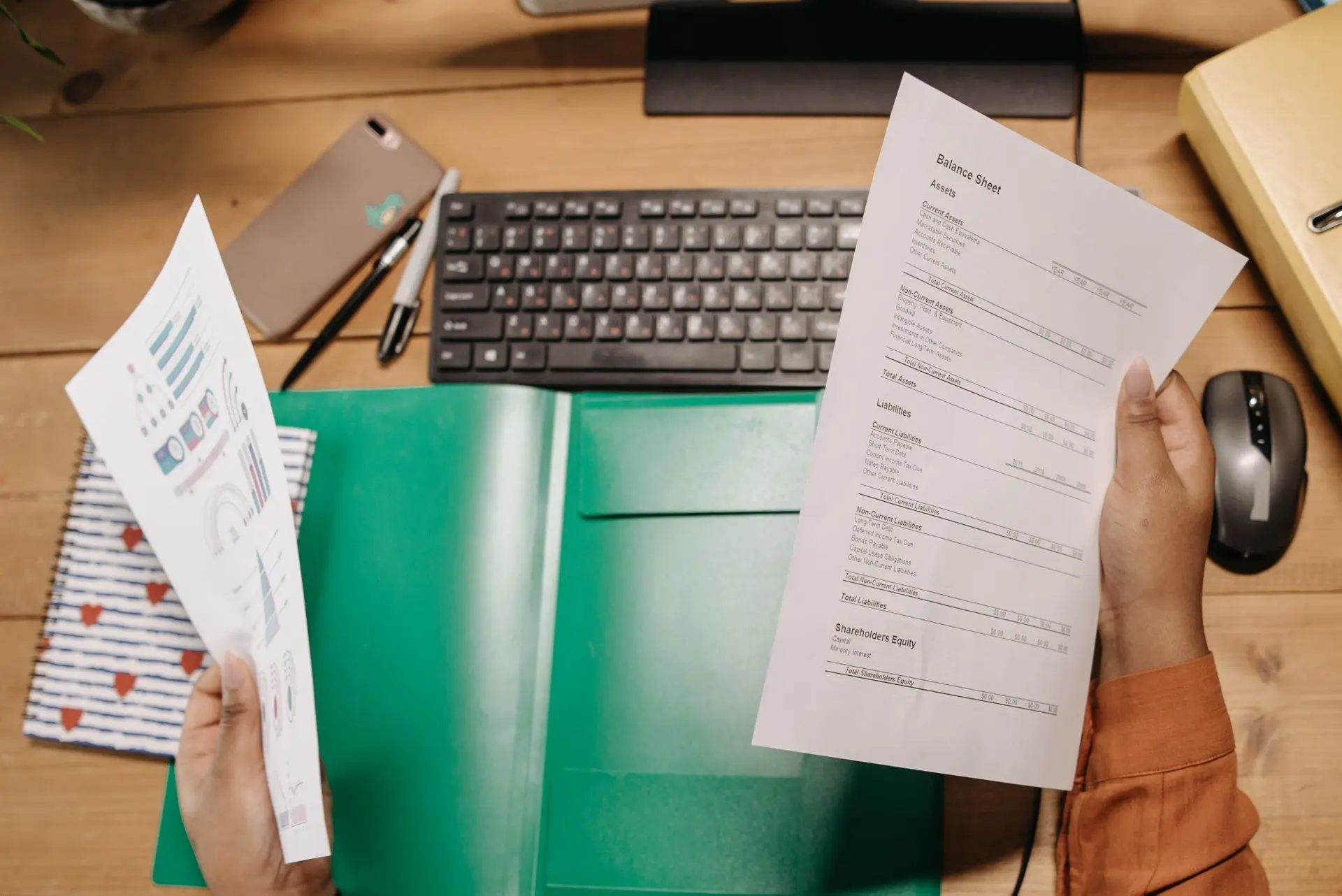 Annual financial statements being reviewed at a desk