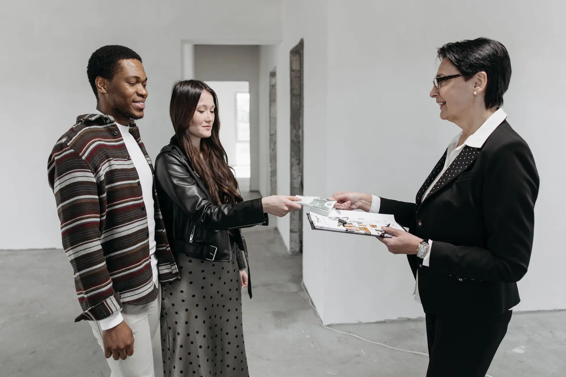 An originator taking a couple through their home loan offers